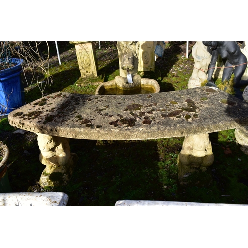 914 - A WEATHERED COMPOSITE CURVED BENCH, on a pair of squirrel shaped bases, length 115cm (condition:-no ... 