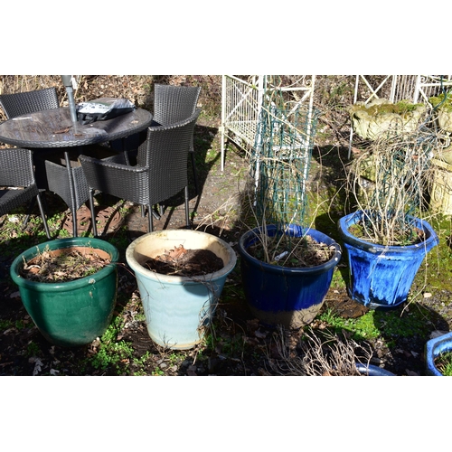 915 - FOUR VARIOUS GLAZED PLANTERS, of the similar size nut differed colours, largest size diameter 52cm x... 