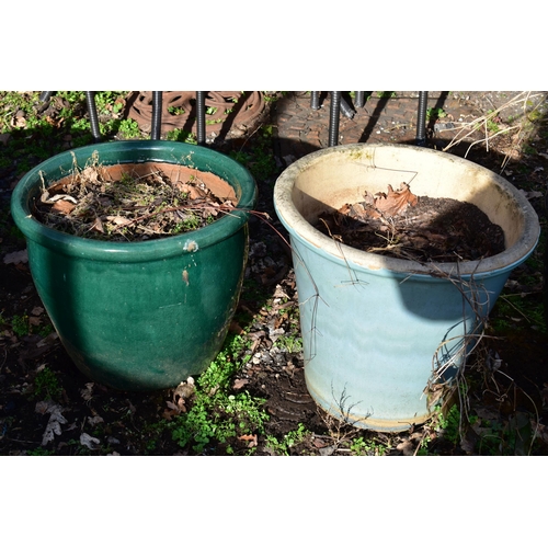 915 - FOUR VARIOUS GLAZED PLANTERS, of the similar size nut differed colours, largest size diameter 52cm x... 