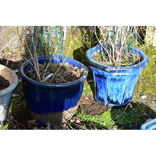 915 - FOUR VARIOUS GLAZED PLANTERS, of the similar size nut differed colours, largest size diameter 52cm x... 