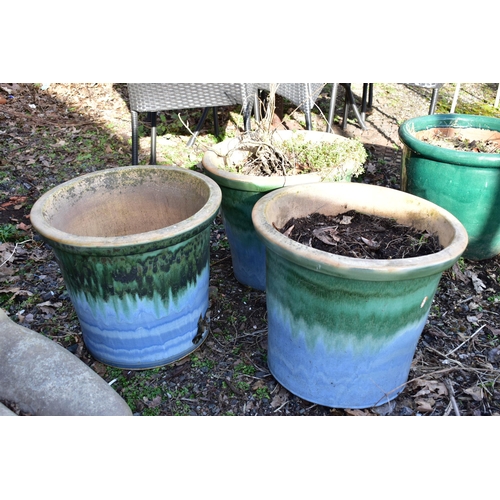 916 - THREE SIMILAR GREEN AND PALE BLUE GLAZED PLANTERS, diameter 46cm x height 39cm (condition:-in weathe... 