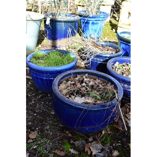 921 - FOUR MATCHING CIRCULAR BLUE GLAZED PLANTERS, diameter 40cm x height 26cm, and two other blue glazed ... 