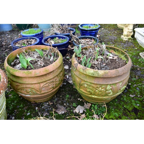 922 - A PAIR OF WEATHERED TERRACOTTA PLANTERS, with floral design, diameter 50cm x height 43cm, and a weat... 