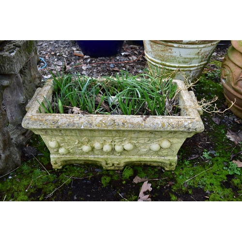 923 - A WEATHERED COMPOSITE RECTANGULAR PLANTER, with floral decoration, length 67cm