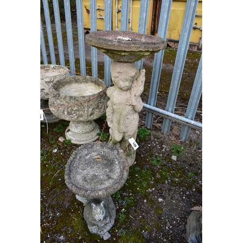 928 - A WEATHERED COMPOSITE FIGURAL BIRD BATH, circular top, on a loose base depicting a putto, diameter 3... 