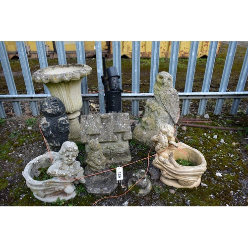 929 - A SELECTION OF WEATHERED COMPOSITE GARDEN ORGAMENTS, to include a tulip shaped urn, figural owl, tha... 