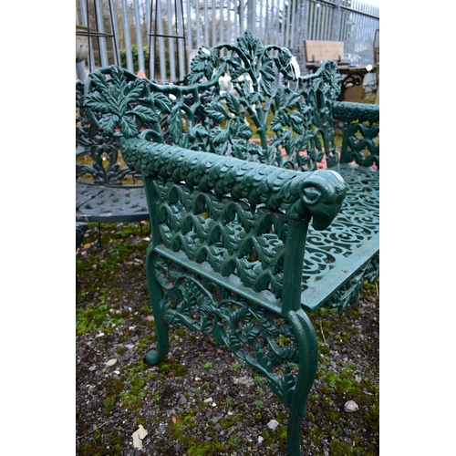 941 - A VICTORIAN STYLE HEAVY CAST IRON GARDEN BENCH, with leaf and vines shaped back, rams head armrest, ... 