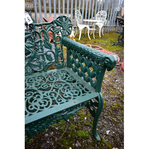 941 - A VICTORIAN STYLE HEAVY CAST IRON GARDEN BENCH, with leaf and vines shaped back, rams head armrest, ... 