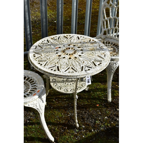 946 - A PAINTED CAST IRON CIRCULAR GARDEN TABLE, diameter 61cm x height 55cm, and two chairs (condition:-a... 