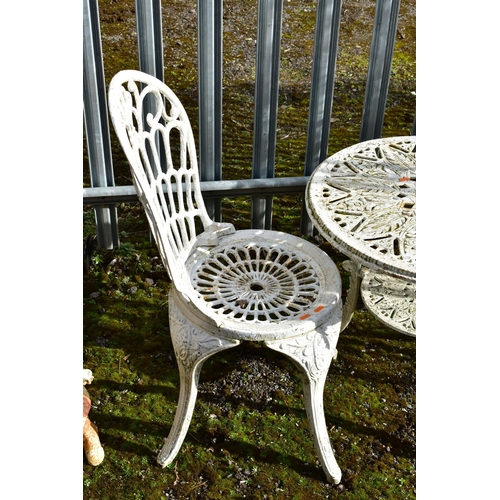 946 - A PAINTED CAST IRON CIRCULAR GARDEN TABLE, diameter 61cm x height 55cm, and two chairs (condition:-a... 