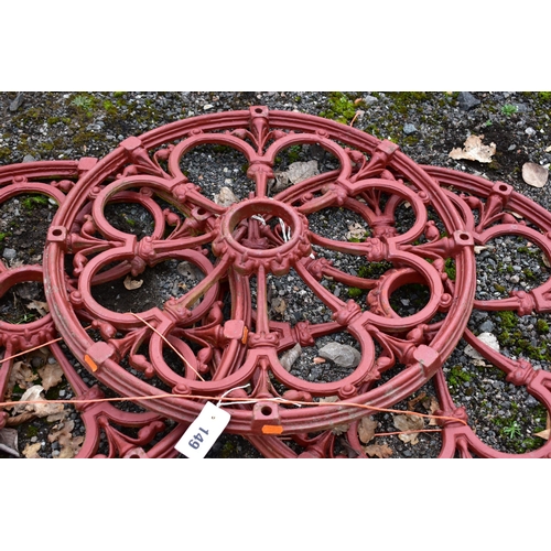 949 - A CAST METAL FOLIATE DESIGN PARASOL BASE, diameter 60cm, along with a set of three decorative cast i... 