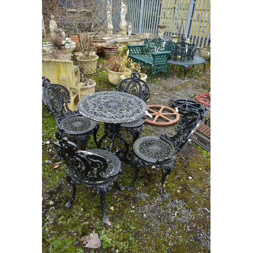 953 - A PAINTED CAST IRON CIRCULAR GARDEN TABLE, diameter 59cm x height 70cm and four chairs (condition:-o... 