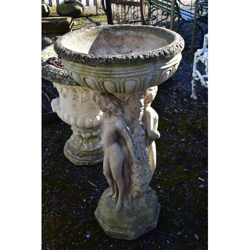 958 - A WEATHERED COMPOSITE PLANTER, on a separate base depicting three standing scantily clad women, on a... 