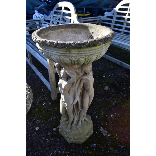 958 - A WEATHERED COMPOSITE PLANTER, on a separate base depicting three standing scantily clad women, on a... 