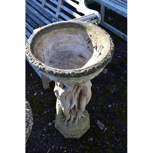 958 - A WEATHERED COMPOSITE PLANTER, on a separate base depicting three standing scantily clad women, on a... 