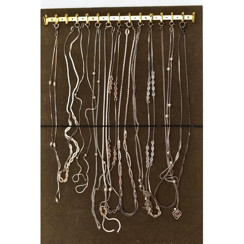 103 - A TRAY OF WHITE METAL CHAINS, twelve chains in total of various styles, all fitted with spring clasp... 