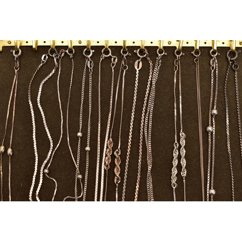 103 - A TRAY OF WHITE METAL CHAINS, twelve chains in total of various styles, all fitted with spring clasp... 