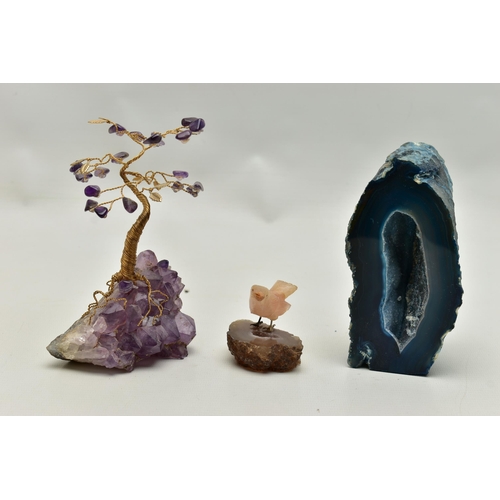 104 - THREE MINERAL SPECIMEMS, the first an amethyst geode, fashioned with a yellow metal wire tree suspen... 