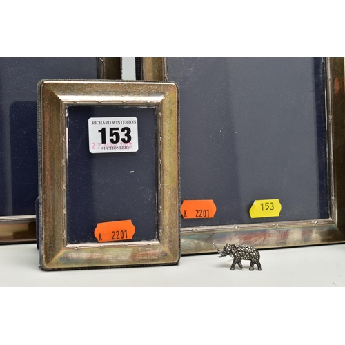 153 - A SET OF FOUR ELIZABETH II SILVER MOUNTED EASEL BACK PHOTOGRAPH FRAMES OF RECTANGULAR FORM, with a r... 