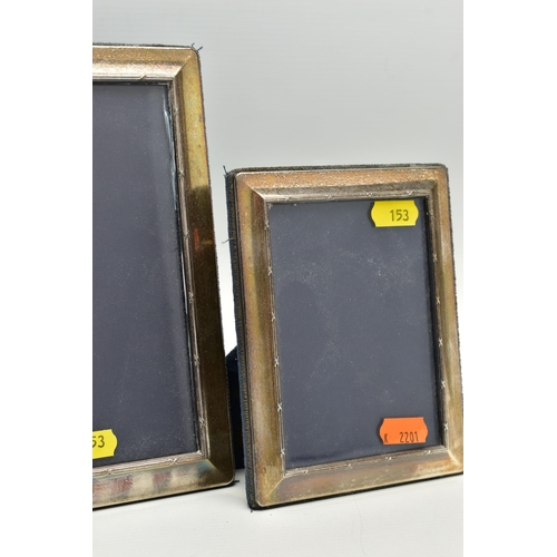 153 - A SET OF FOUR ELIZABETH II SILVER MOUNTED EASEL BACK PHOTOGRAPH FRAMES OF RECTANGULAR FORM, with a r... 