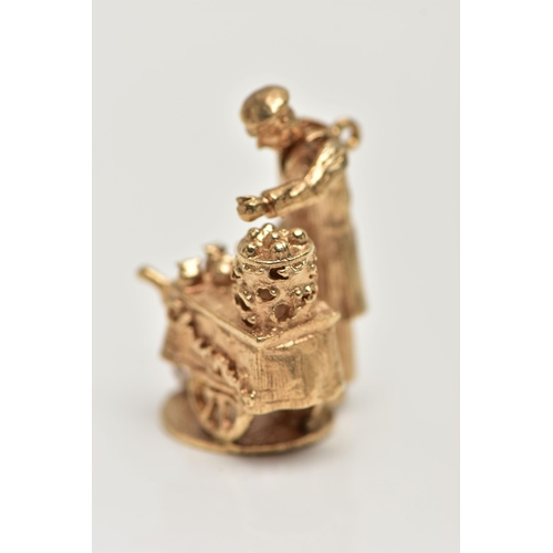 18 - A 9CT GOLD CHARM, yellow gold kinetic charm of a man at a cart, hallmarked 9ct London, approximate g... 