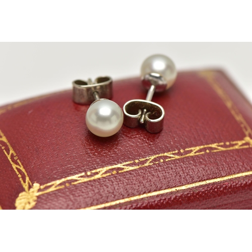 2 - A PAIR OF CULTURED PEARL STUD EARRINGS, each earring set with a cultured pearl, measuring approximat... 