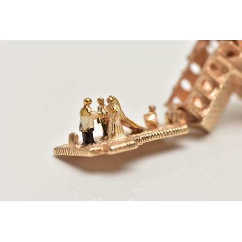 20 - A 9CT GOLD CHARM, yellow gold charm of a church, hinged base, opens to reveal a wedding, hallmarked ... 