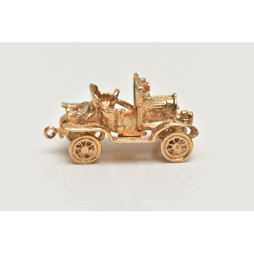 21 - A 9CT GOLD CHARM,  yellow gold charm of a car with moving wheels, hallmarked 9ct London, approximate... 