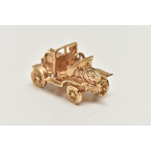 21 - A 9CT GOLD CHARM,  yellow gold charm of a car with moving wheels, hallmarked 9ct London, approximate... 