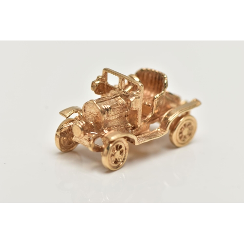 21 - A 9CT GOLD CHARM,  yellow gold charm of a car with moving wheels, hallmarked 9ct London, approximate... 