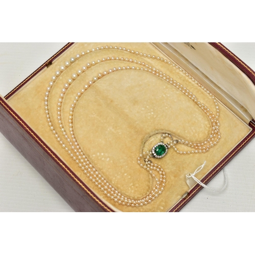 4 - A CULTURED PEARL NECKLACE WITH EMERALD AND DIAMOND CLASP, designed as three graduating rows of cultu... 