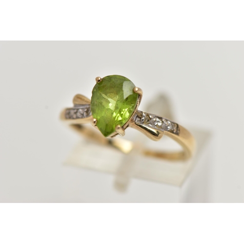 49 - A 9CT GOLD, PERIDOT AND DIAMOND RING, designed with a four claw set, pear cut peridot, flanked with ... 