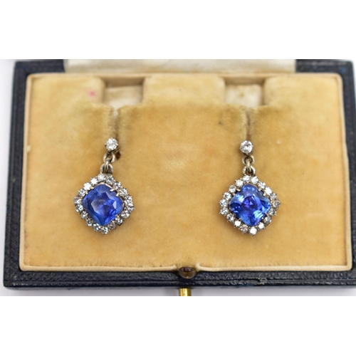 5 - A PAIR OF EARLY 20TH CENTURY SAPPHIRE AND DIAMOND EARRINGS, each earring set with a cushion cut sapp... 