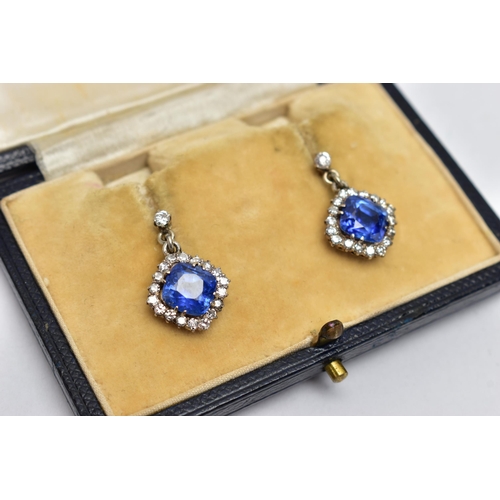 5 - A PAIR OF EARLY 20TH CENTURY SAPPHIRE AND DIAMOND EARRINGS, each earring set with a cushion cut sapp... 