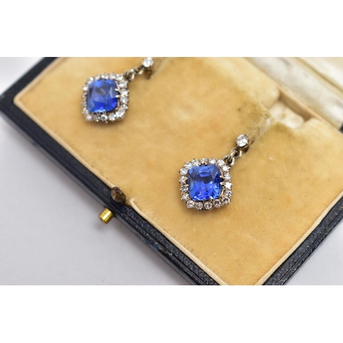 5 - A PAIR OF EARLY 20TH CENTURY SAPPHIRE AND DIAMOND EARRINGS, each earring set with a cushion cut sapp... 