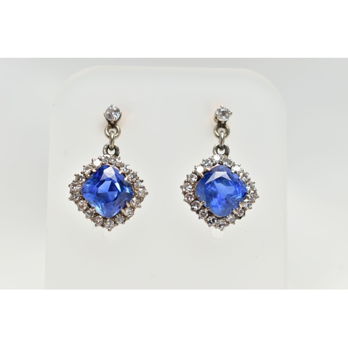 5 - A PAIR OF EARLY 20TH CENTURY SAPPHIRE AND DIAMOND EARRINGS, each earring set with a cushion cut sapp... 