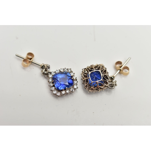 5 - A PAIR OF EARLY 20TH CENTURY SAPPHIRE AND DIAMOND EARRINGS, each earring set with a cushion cut sapp... 