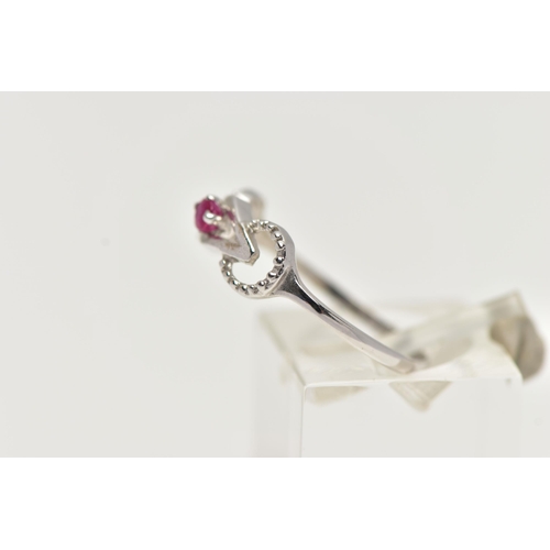 53 - A 9CT WHITE GOLD RUBY RING, designed with a claw set, circular cut ruby, in an openwork mount leadin... 