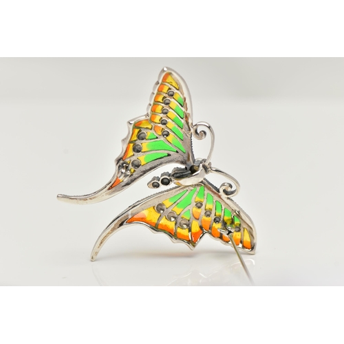 54 - A WHITE METAL PLIQUE A JOUR BROOCH, in the form of butterfly with red, green and yellow enamel wings... 