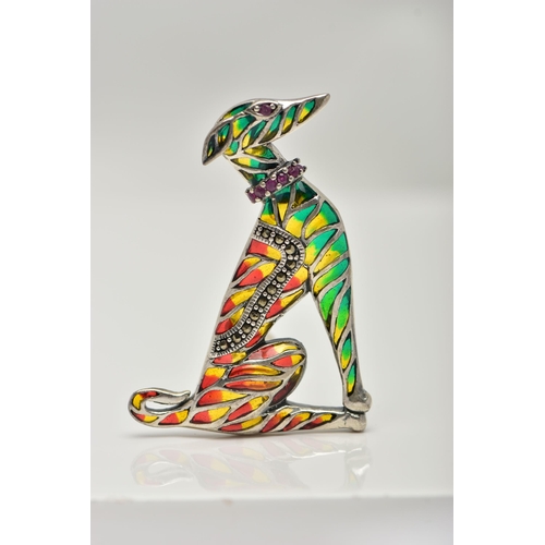 55 - A WHITE METAL PLIQUE A JOUR BROOCH, in the form of a seated dog, decorated with red, green and yello... 