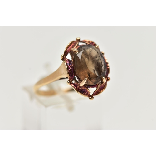 57 - A 9CT GOLD SMOKY QUARTZ RING, designed with a claw set, oval cut smoky quartz, within an openwork su... 