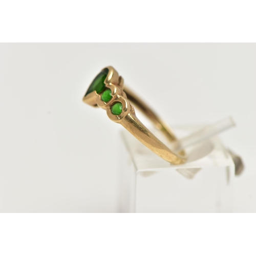 58 - A 9CT GOLD CHROME DIOPSIDE RING, designed with a central pear cut stone flanked with four smaller ci... 