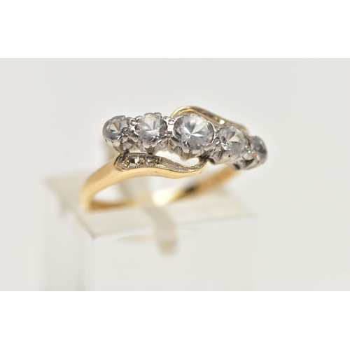 70 - A YELLOW METAL GEM SET RING, designed with a row of five graduated colourless spinels in a white met... 