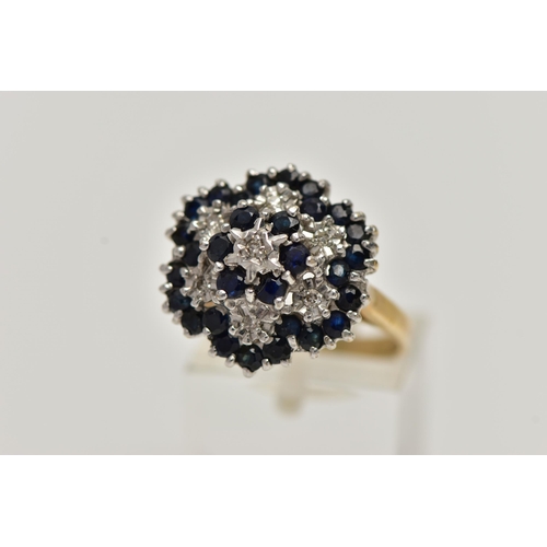 72 - A 9CT GOLD CLUSTER RING, seven single cut diamonds set with thirty circular cut blue sapphires, lead... 