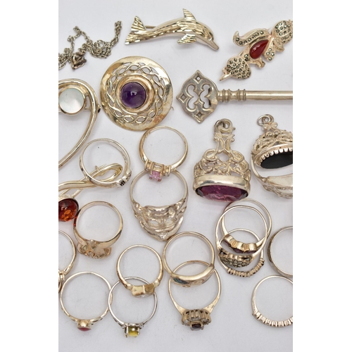 87 - AN ASSORTMENT OF WHITE METAL JEWELLERY, to include three white metal fobs, an assortment of rings, b... 