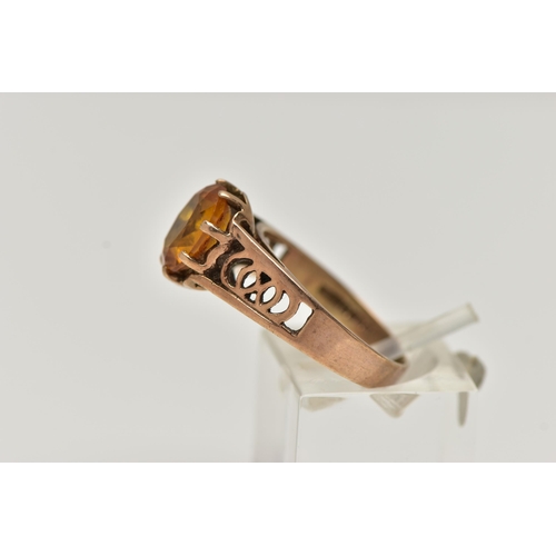 89 - A 9CT GOLD GEMSTONE RING, designed with a six claw set, oval cut orange stone assessed as sapphire, ... 