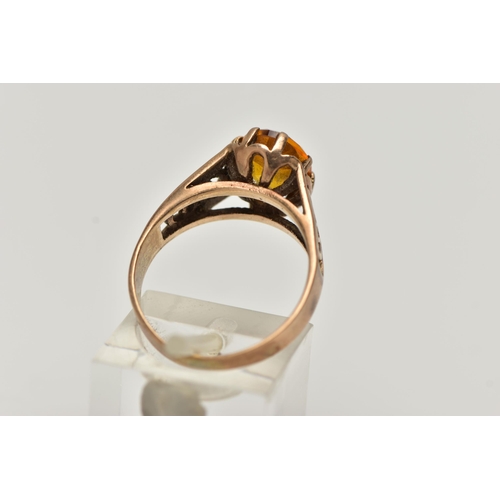 89 - A 9CT GOLD GEMSTONE RING, designed with a six claw set, oval cut orange stone assessed as sapphire, ... 