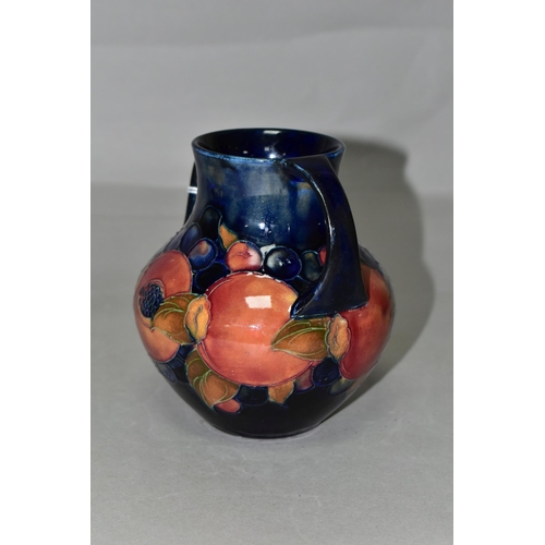 346 - A MOORCROFT POTTERY POMEGRANATE TWIN HANDLED VASE, of amphora style, tube lined with pomegranates an... 