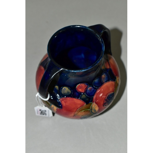 346 - A MOORCROFT POTTERY POMEGRANATE TWIN HANDLED VASE, of amphora style, tube lined with pomegranates an... 