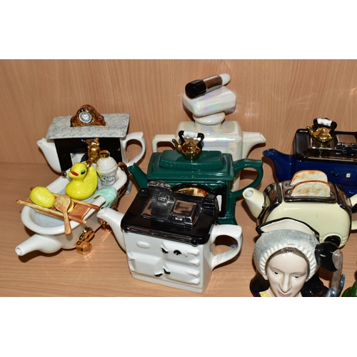 352 - A COLLECTION OF NOVELTY TEAPOTS AND CHARACTER JUGS, comprising eight novelty teapots in the forms of... 